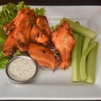 Buffalo Wings · Wings and drumettes in buffalo sauce with celery and bleu cheese.