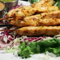 Chicken Satay Skewers · Grilled chicken with peanut sauce and cilantro vinaigrette.