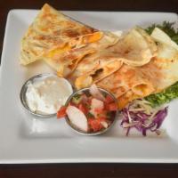 Chicken Quesadilla · Chicken, cheddar-jack cheese and smoked onions in a flour tortilla. Served with pico de gall...