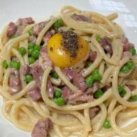 Spaghetti Carbonara · Pancetta, English Peas, Egg Yolk, Parmesan. (gluten-free pasta available)