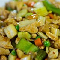 Kung Pao Chicken · Spicy. Chicken stir-fried with fresh onions, bell peppers, carrots, peas, and peanuts in spi...
