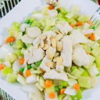 Almond Chicken · Diced chicken, onions, celery, peas, carrots, water chestnuts, and topped with almonds.