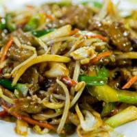 Mongolian Beef · Spicy. Sliced beef sauteed with onions, bell peppers, bean sprouts, cabbage, and carrots in ...
