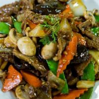 Beef With Black Mushrooms · Sliced beef stir-fried with mushrooms, snow peas, onions, carrots, water chestnuts, and blac...
