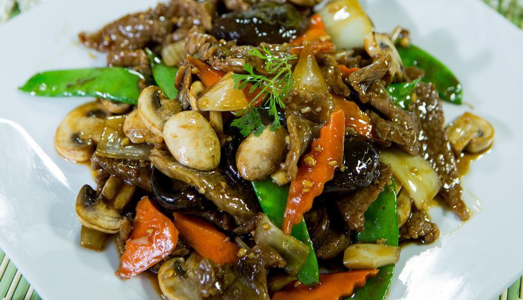 Beef With Black Mushrooms · Sliced beef stir-fried with mushrooms, snow peas, onions, carrots, water chestnuts, and black mushroom in brown sauce.