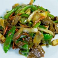 Beef With Oyster Sauce · Tender beef sautéed with snow peas, carrots, onions, and bell peppers in oyster sauce.