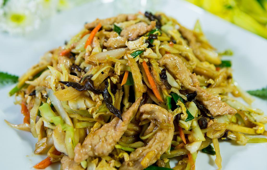Mu Shu Pork · Sliced pork, scrambled egg, cabbage, onions, carrots, and stir-fried in a house sauce. Optionally served with hoisin sauce and 5 thin Chinese pancakes.