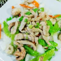 Pork With Snow Peas · Pork stir-fried with snow peas, mushrooms, onions, water chestnuts, and carrots in house sau...