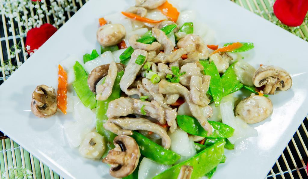 Pork With Snow Peas · Pork stir-fried with snow peas, mushrooms, onions, water chestnuts, and carrots in house sauce.