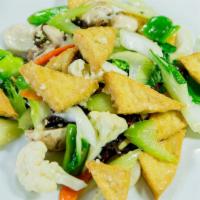 Buddhist Delight · Deep fried tofu stir-fried with broccoli, celery, carrots, cauliflower, and mushrooms.
