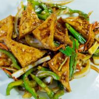 Szechuan Tofu · Deep fried tofu stir-fried with onions, bell peppers, celery, and carrots in a spicy szechua...