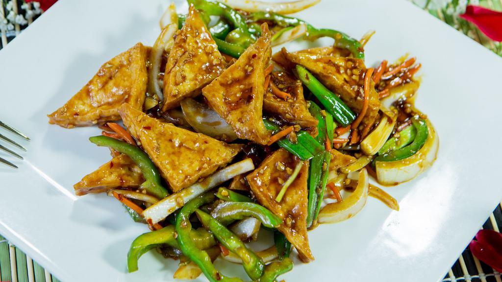 Szechuan Tofu · Deep fried tofu stir-fried with onions, bell peppers, celery, and carrots in a spicy szechuan sauce.