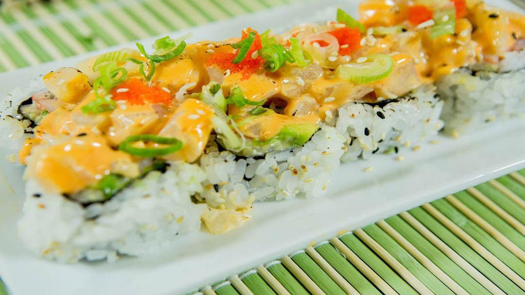 Volcano Roll (8 Pcs.) · Inside: baked spicy scallop with masago and scallion top on California roll.