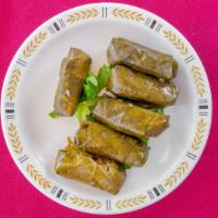 Dolmas (6 Pcs) · Hand-rolled grape leaves stuffed vegan mixture of tomatoes, parsley, onions, and rice. Seaso...