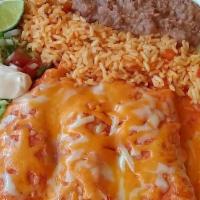 Enchiladas Plate  · Filled with chicken or beef covered with red sauce and Mexican cheese. 
Served with rice, be...