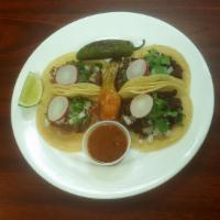 Tacos  · Onions, cilantro, radish. Choice of meat