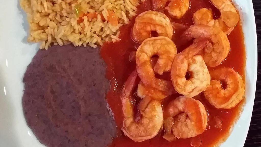 Camarones A La Diabla  · Shrimp cooked with onions and hot sauce. Served with rice, beans and corn tortilla