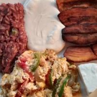 Desayuno Salvadoreño ( Salvadorean Breakfast ) · Scrambled eggs, mix rice, beans, fried plantain, sour cream and fresh cheese