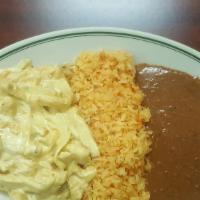 Pollo En Crema  · Chicken breast strips cooked in a delicious creamy sauce served whith rice, beans and corn t...