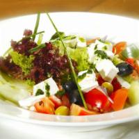 Fresh Greek Salad With Feta Cheese · Fresh Salad prepared with Lettuce, Tomatoes, cucumbers, red onions, green peppers, feta chee...