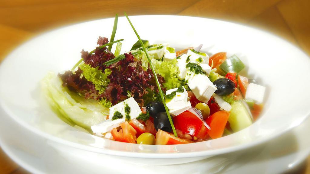 Fresh Greek Salad With Feta Cheese · Fresh Salad prepared with Lettuce, Tomatoes, cucumbers, red onions, green peppers, feta cheese, black olives & Greek dressing.
