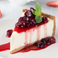 Cherry Cheesecake · Classic cheesecake with a rich, dense, smooth, and creamy consistency topped with fresh cher...