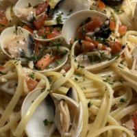 Linguine Clams (Dinner) · Manila clams and linguine pasta tossed in a white wine garlic sauce and tomato blend.