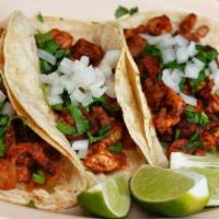 3 Al Pastor Tacos · Pork. Served on corn tortillas, with cilantro, onions, salsa picante and avocado slices, wit...