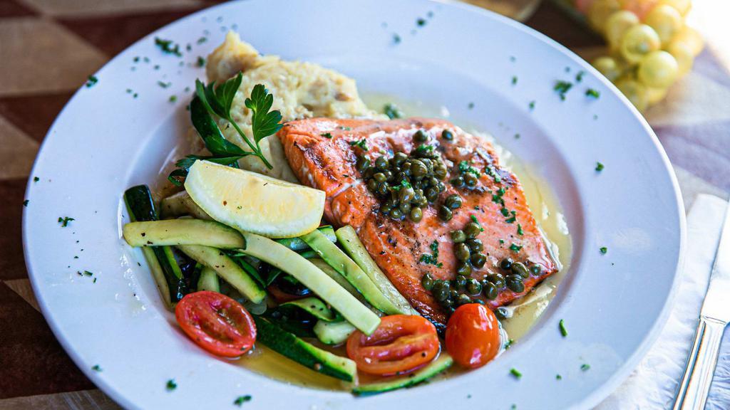 Salmon Picatta · Gluten-free. Grilled wild Alaskan salmon topped with our homemade lemon butter sauce. Includes sautéed vegetables and garlic parmesan mashed potatoes.