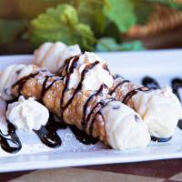 Sweet Cannolis · Two sweet Cannoli shells (Fried Pastry Dough) filled with a sweet creamy mixture of ricotta ...