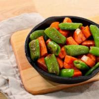 Sugar Snap Peas & Carrots · Turn eating veggies from a chore into a delight. This is the healthy veggie side of your chi...