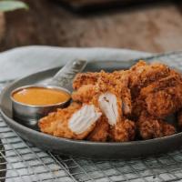 Twisted Tenders · 6 crispy buttermilk-marinated tenders breaded in twisted flour. choice of 2 sauces.
