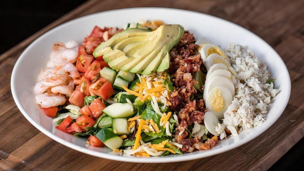 Seafood Cobb · Shrimp, crab, Roma tomatoes, avocado, egg, cucumbers, bacon, cheddar & pepper jack cheeses