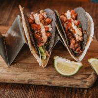 Cajun Fish Tacos · Three blackened cod tacos, cajun rémoulade, pepper jack cheese, lettuce & pico de gallo, cho...