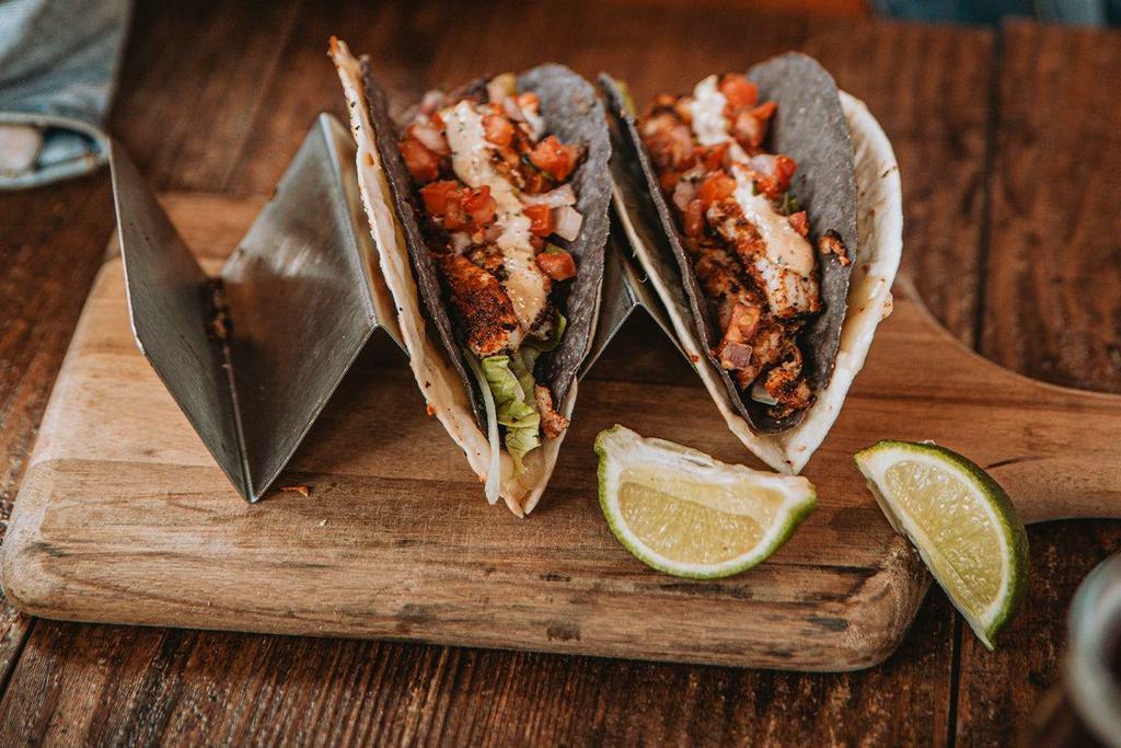 Cajun Fish Tacos · Three blackened cod tacos, cajun rémoulade, pepper jack cheese, lettuce & pico de gallo, choice of side.