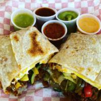 Breakfast Burrito · Choice of meat or vegetarian with scrambled eggs, potatoes, sour cream and cheese wrapped in...