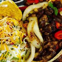  Fajita Plate · Grill bell peppers and onions, choice of meat, tofu or veggie pastor (marinated soy). Rice, ...