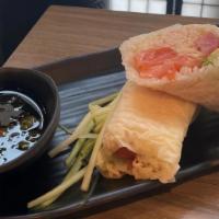 Sushi Burrito · Raw. Tuna, salmon, crab mix, avocado, cucumber, wrapped in soy paper, and spicy ponzu sauce....