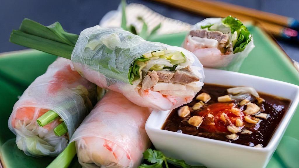 Salad Rolls · rice paper rolls with shrimp, pork, noodles, lettuce, sprouts & peanut sauce. (4 pc)