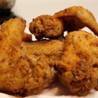 Fried Chicken Wings · fried marinated chicken wings in special homemade fish sauce. 4 pieces.