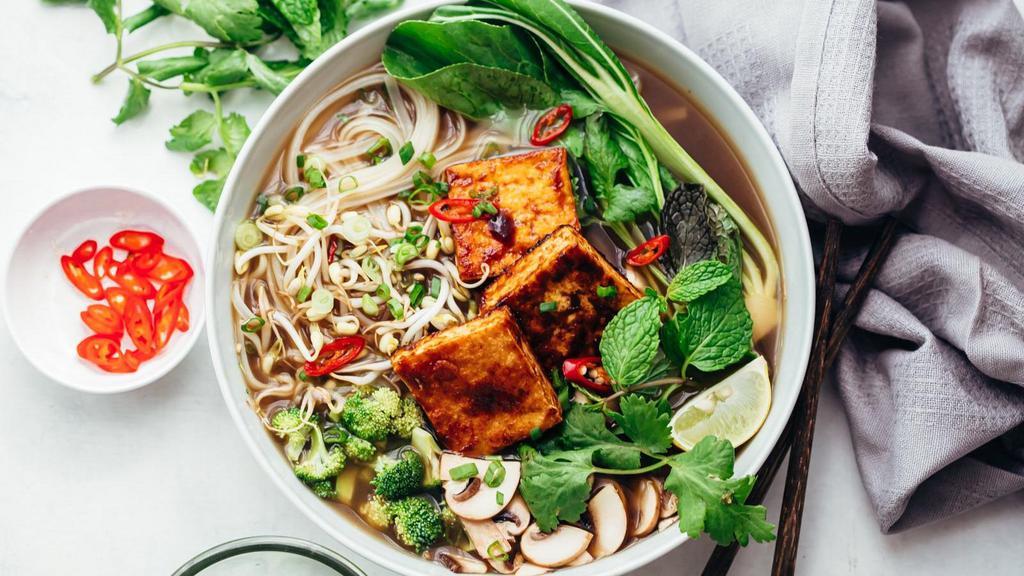 Vegan Phở · rice noodles, mushroom, tofu, carrot, broccoli, baby corn, bok choy in veggie broth.
