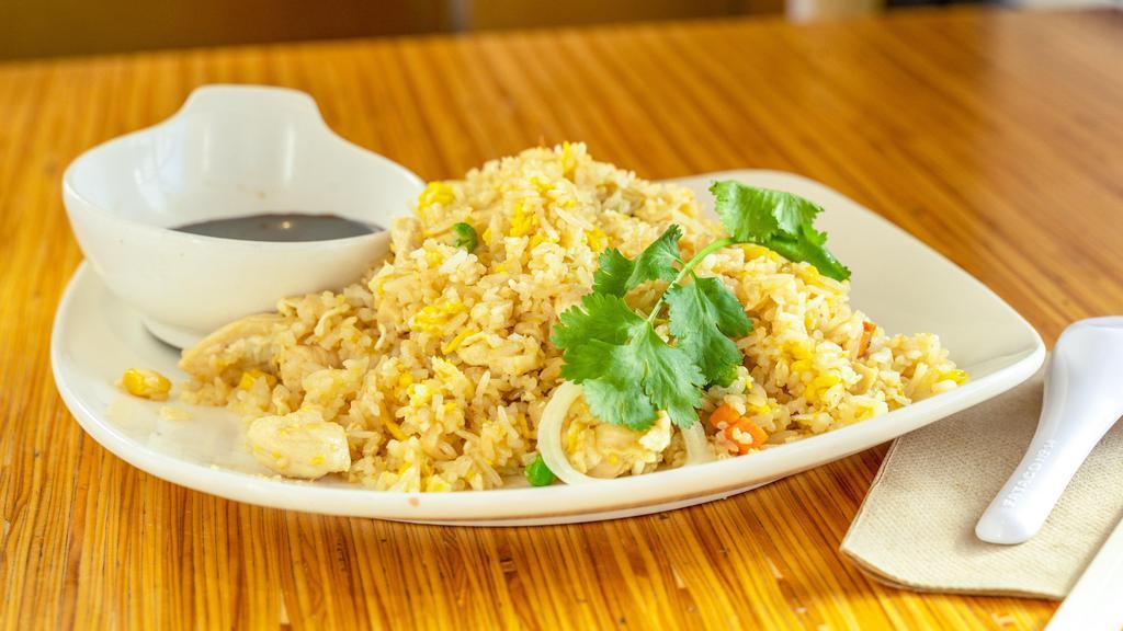 Chicken Fried Rice · Jasmine rice stir-fried with chicken, scallion, peas, carrot and egg.