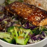 Salmon Teriyaki Bowl · Seasoned Salmon, Jasmine Rice, House greens, Steamed Coleslaw Mix (Cabbage, Broccoli, Shredd...