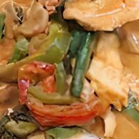 Panang Curry · Zesty red curry cooked in Thai coconut milk with assorted veggies; mainly green beans, kaffi...