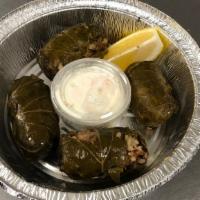 Dolmathes (Stuffed Grape Leaves) · Ala Carte comes with 4 Dolmathes and white sauce.