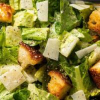 Caesar Chicken Salad · Romaine lettuce, parmesan cheese, garlic croutons, and chicken.