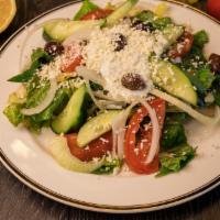 Greek Salad · Chopped romaine, tomatoes, onions, cucumbers, olive, feta cheese, tzatziki and Greek dressing.