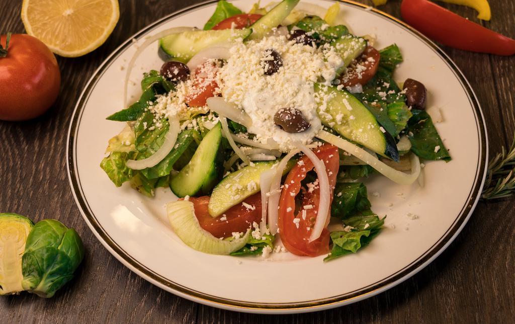 Greek Salad · Chopped romaine, tomatoes, onions, cucumbers, olive, feta cheese, tzatziki and Greek dressing.