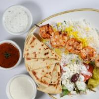 Shrimp Kabob · One skewer of shrimp kabob served with basmati rice, pita bread, tzatziki sauce, and Greek s...