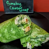 Chicken Caesar Wrap · Smoky Chicken Caesar Salad wrapped in a spinach tortilla.  Chicken, Parmesan, Romaine, and C...